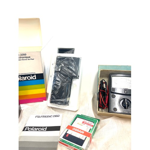 276 - Large selection of camera equipment, includes microphones, polaroid, batteries, leads etc