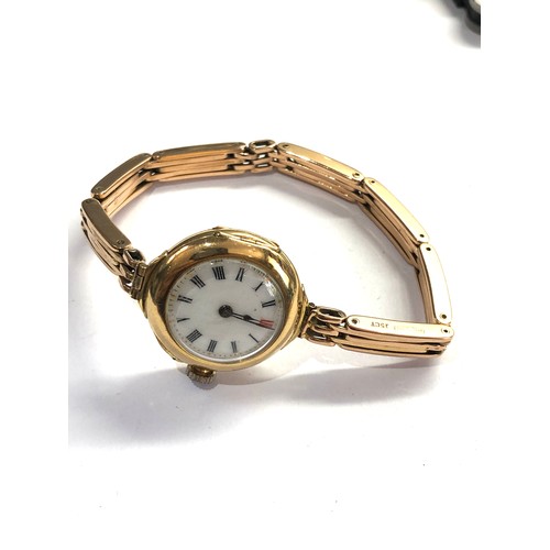 463 - Antique 18ct gold wristwatch and 15ct gold strap total weight 28.5g watch winds and ticks but no war... 