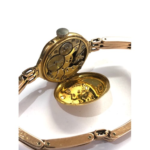 463 - Antique 18ct gold wristwatch and 15ct gold strap total weight 28.5g watch winds and ticks but no war... 