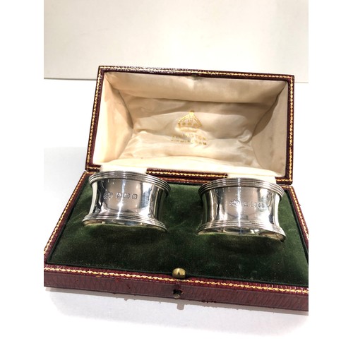 31 - Boxed pair of silver napkin ring