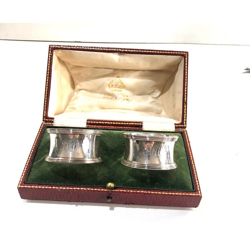 31 - Boxed pair of silver napkin ring