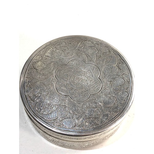 39 - Round islamic Egyptian silver box measures approx 9.5cm dia height 3.7cm weight 154g