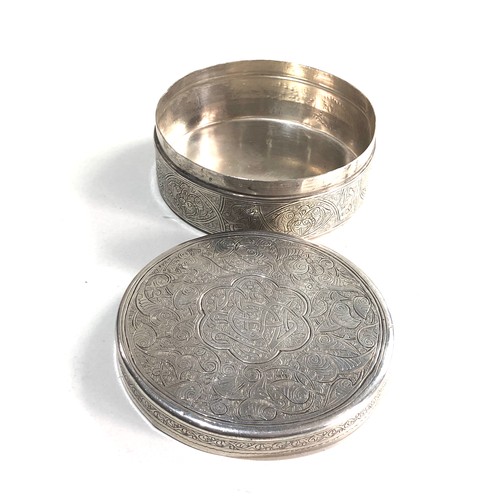 39 - Round islamic Egyptian silver box measures approx 9.5cm dia height 3.7cm weight 154g