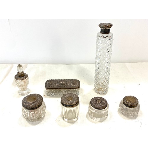 673 - Selection of 7 Silver rimmed trinket bottles