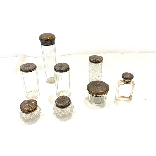 669 - Selection of 8 Silver rimmed trinket bottles