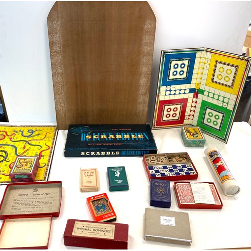 254 - Selection of vintage games includes snakes and ladders, ludo, scrabble, puzzles etc