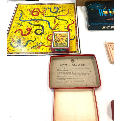 254 - Selection of vintage games includes snakes and ladders, ludo, scrabble, puzzles etc