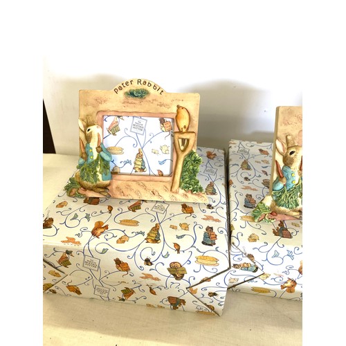 86 - 3 boxed Peter rabbit picture frames and a Boxed Wedgwood peter rabbit bowl