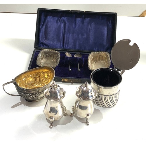 60 - Selection of silver items salt peppers etc