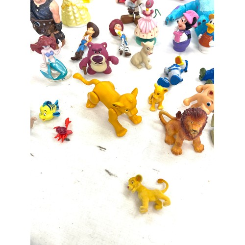 74 - Disney toy figures to include Dwarfs, Shrek, Rapunzel, cinderella, monsters, Paw patrol, Lion King, ... 