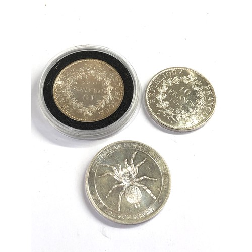 522 - 3  silver coins includes 2  10 francs and 1oz elizabeth 1 dollar