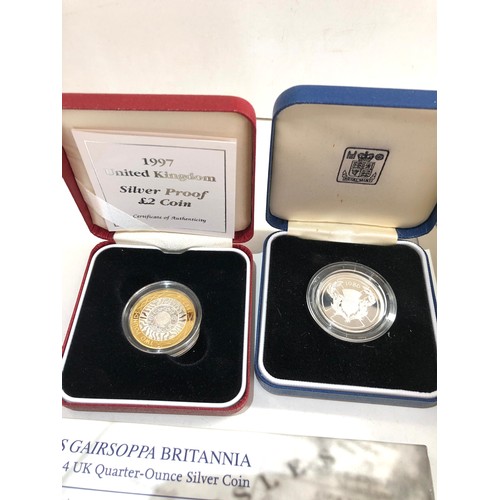 528 - Selection of 5 silver coins includes royal mint £2 britannia quarter ounce , 2 silver proof £2 etc