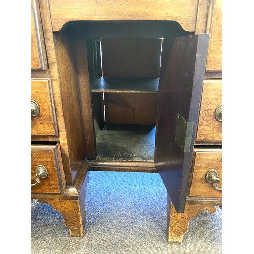 375 - Period knee hole desk, cupboard under, secretare top drawer, approximate measurements: Height 33.5 i... 