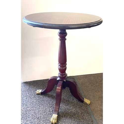 408 - Round occasional table with brass feet, damage to top measures approx 16