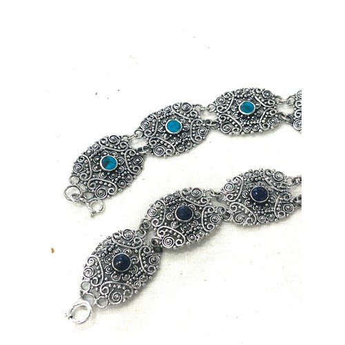 675 - 2 Ladies silver ornate detailed bracelets, stone set