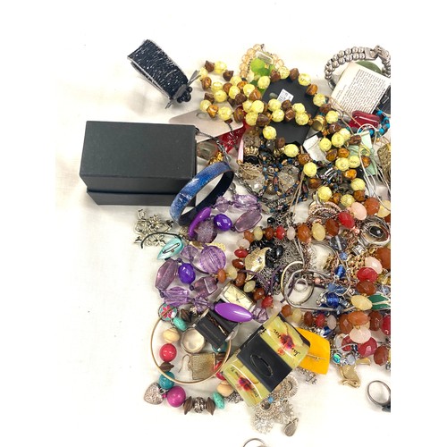 591 - Large selection of costume jewellery includes perfume bottles etc