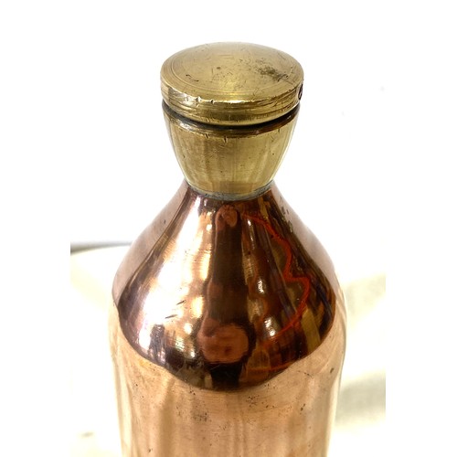 16 - Copper bottle with brass screw top, approximate height 11 inches