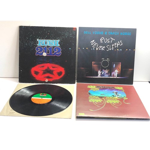 577 - 4 vintage lps includes Led Zepplin Rush 2112 yesssongs and neil young rust never sleeps