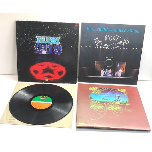 577 - 4 vintage lps includes Led Zepplin Rush 2112 yesssongs and neil young rust never sleeps