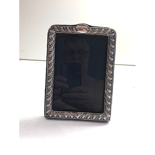 37 - Silver picture frame measures approx 17.7cm by 12cm