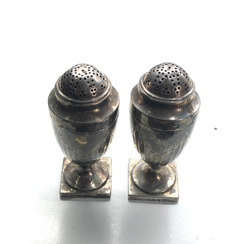 19 - Pair of Georgian silver peppers each measure approx 10cm tall weight 163g hallmarks worn to 1 as sho... 