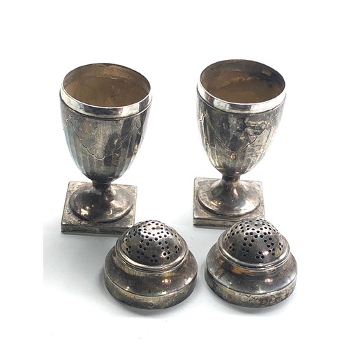 19 - Pair of Georgian silver peppers each measure approx 10cm tall weight 163g hallmarks worn to 1 as sho... 