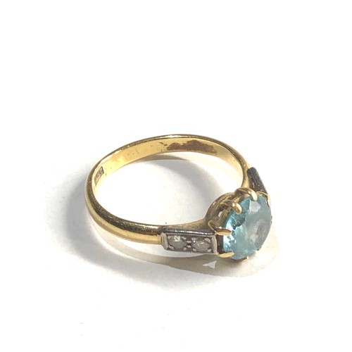 336 - 18ct gold zircon & diamond shouldered ring (4.1g)