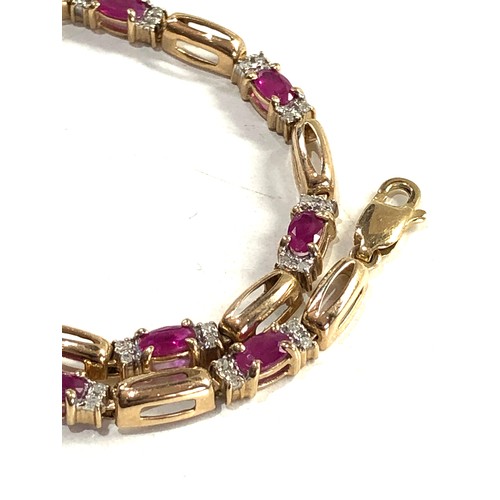 297 - 9ct gold diamond and ruby link bracelet (5.8g)