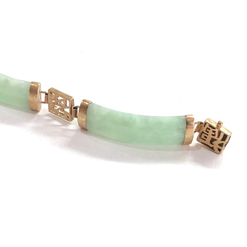 323 - 9ct gold jade lucky symbol link bracelet (10.9g)