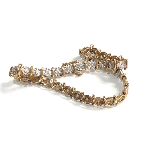 296 - 9ct gold diamond detail tennis bracelet (6.4g)