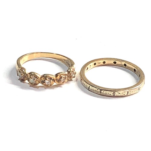 384 - 2 x 9ct gold diamond rings (4.3g)