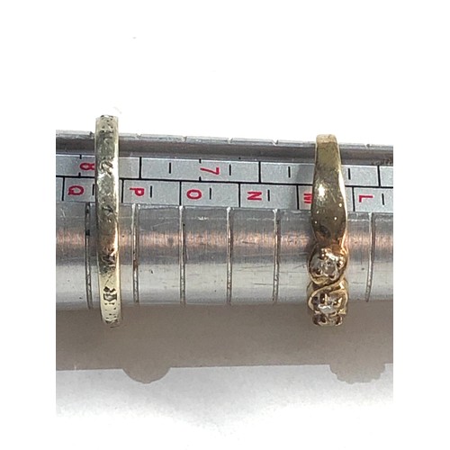 384 - 2 x 9ct gold diamond rings (4.3g)