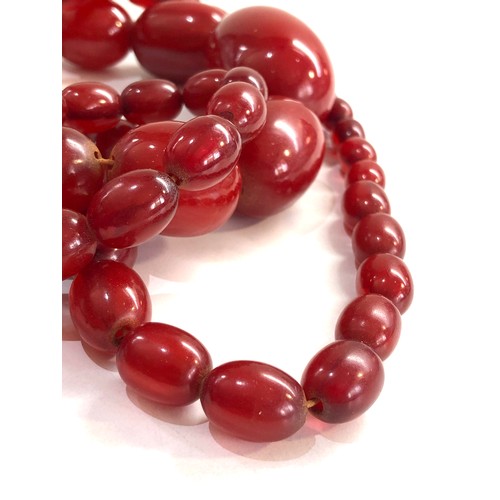 476 - Cherry amber bakelite bead necklace with internal streaking 193g