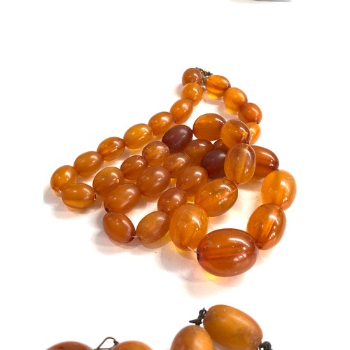 468 - 2 x  amber bead necklaces 53g