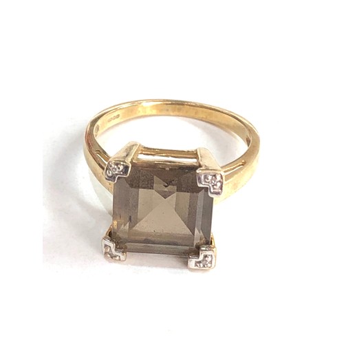 106 - 9ct gold diamond & smoky quartz ring 3.8g