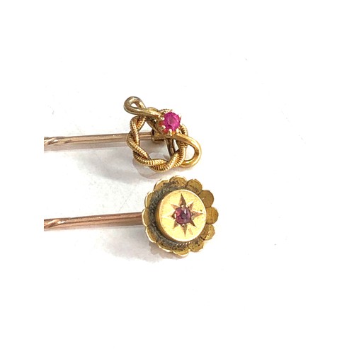 108 - 2 15ct gold ruby stick pins 2.4g