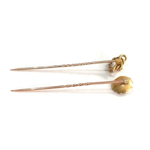 108 - 2 15ct gold ruby stick pins 2.4g