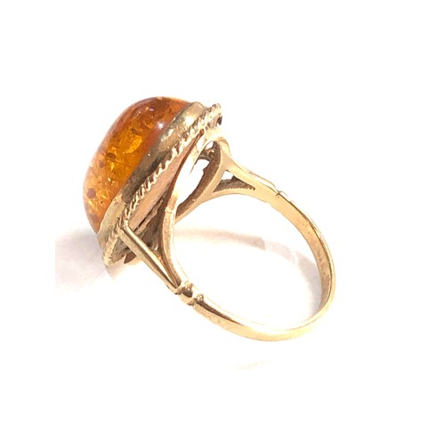 130 - 9ct gold amber ring 4g