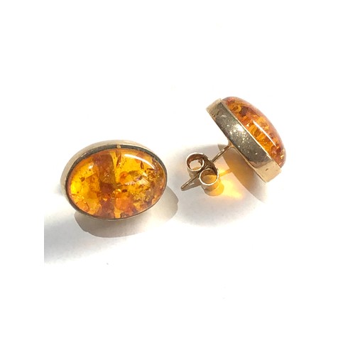 134 - 9ct gold amber earrings 3.3g