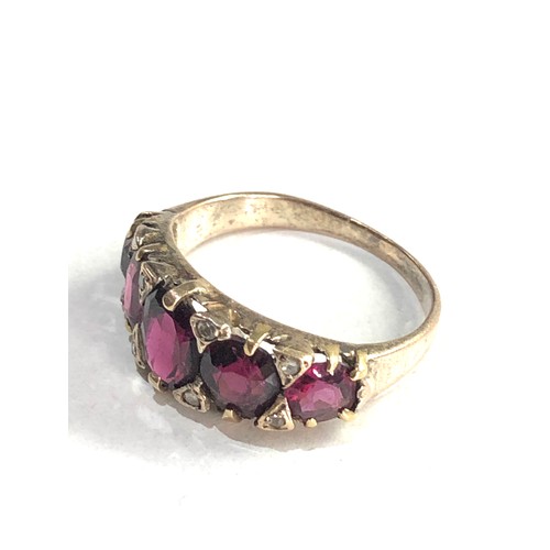 216 - 9ct gold garnet & diamond ring 3.2g