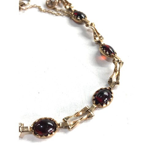 233 - 9ct gold garnet bracelet 4.6g