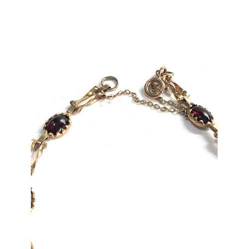 233 - 9ct gold garnet bracelet 4.6g