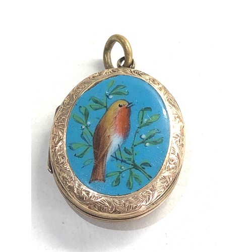 244 - Antique gold back and front enamel locket measures approx 3cm by 2.2cm