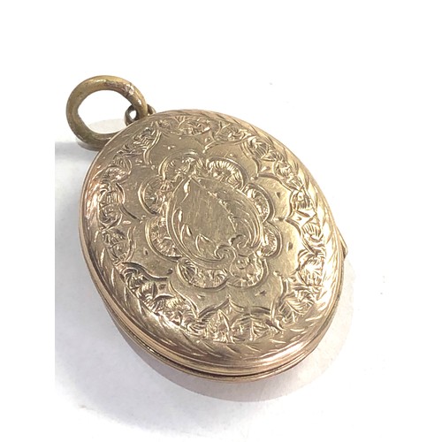 244 - Antique gold back and front enamel locket measures approx 3cm by 2.2cm