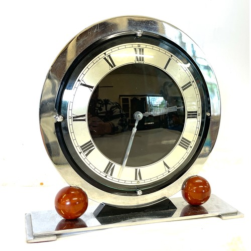 42 - Art Deco chrome mantel clock mounted with catalin balls
