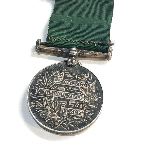 575 - G.V Volunteer force long service medal to gnr.j.flanagan 1 bde .r.a.a.f.f.i