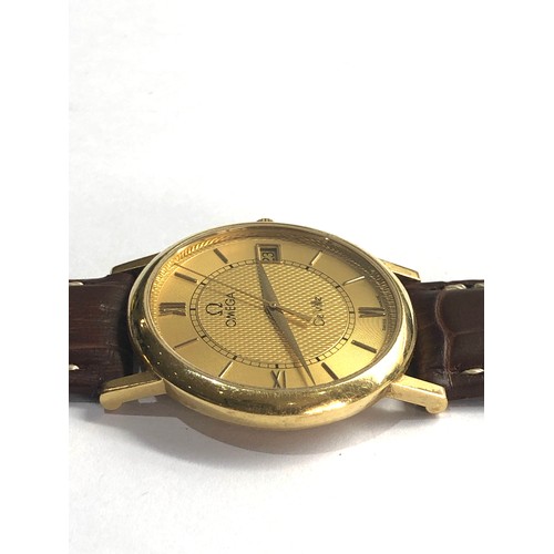 79 - 18ct gold gents  Omega de ville quartz omega leather strap requires battery in good condition no war... 