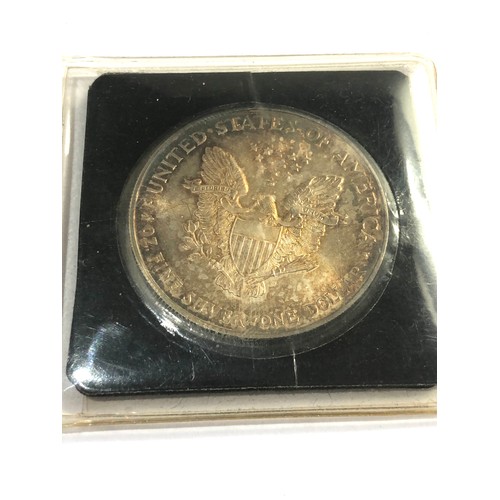 583 - 1995 silver eagle silver dollar c.o.a toned