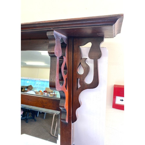 232 - Overmantle with 2 bevelled mirrors and side scrolls, approximate measurements: 43 inches by 30 inche... 