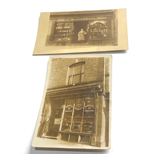 582 - 2 early 1900s shop front real photo postcards